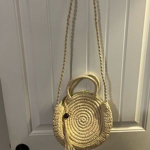 Beachly subscription box rattan round purse with beautiful puca shell tassel